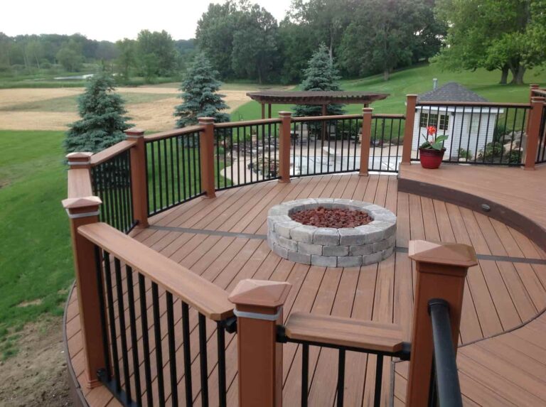Well-maintained backyard with brick walkways, lawn, and landscaped garden beds, representing home service franchises.